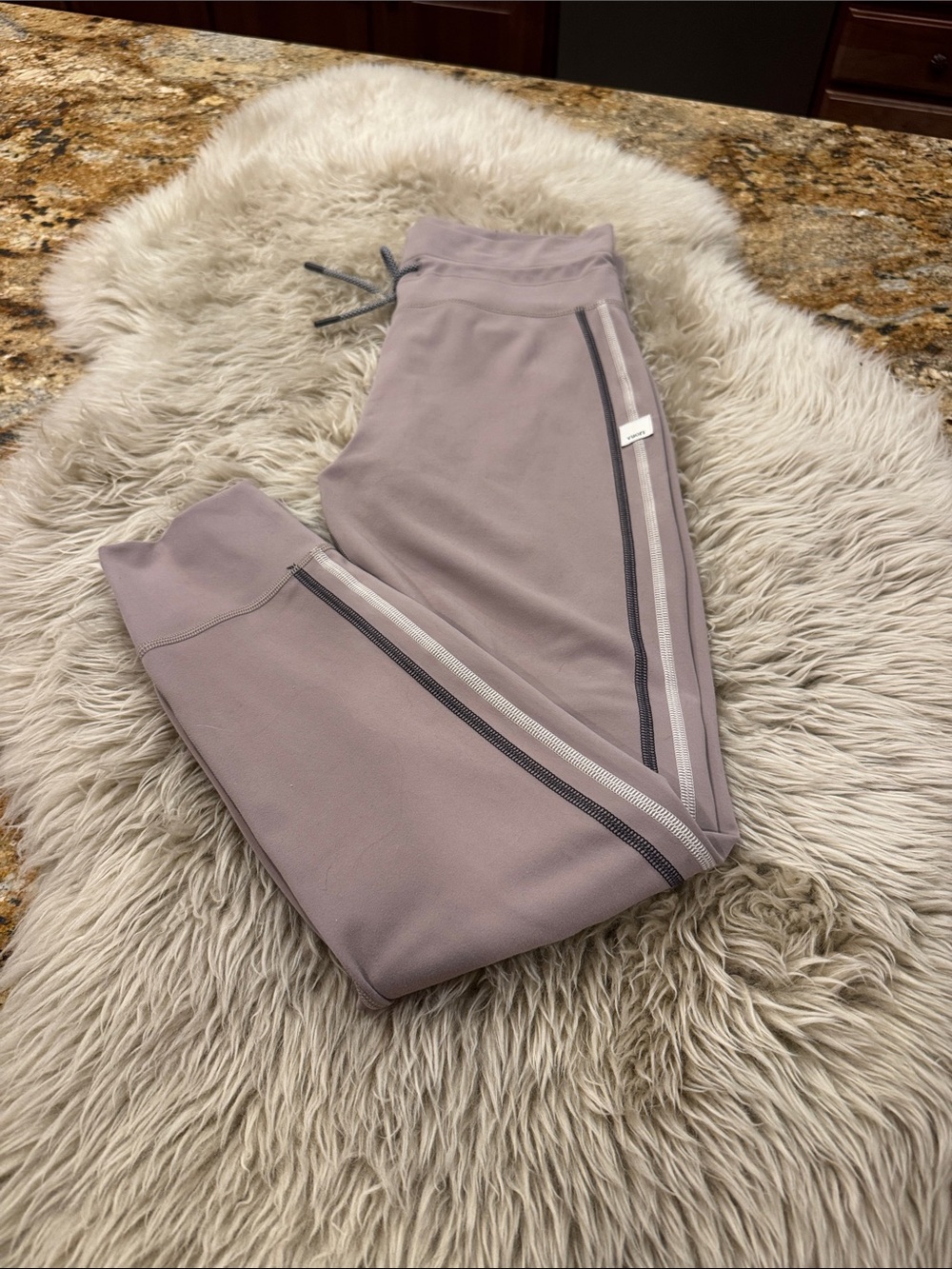 Vuori Daily Leggings. Taupe color with pinstripe. Size S. Like new!